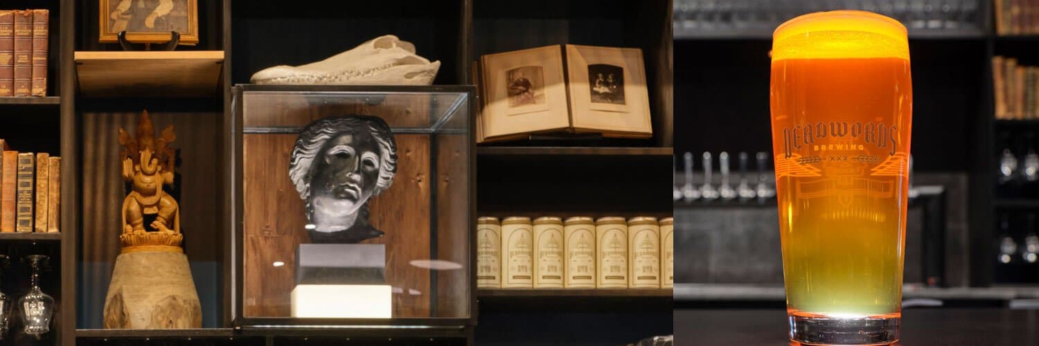 Curiosities on the Deadwords shelves beside a freshly poured Deadwords pint